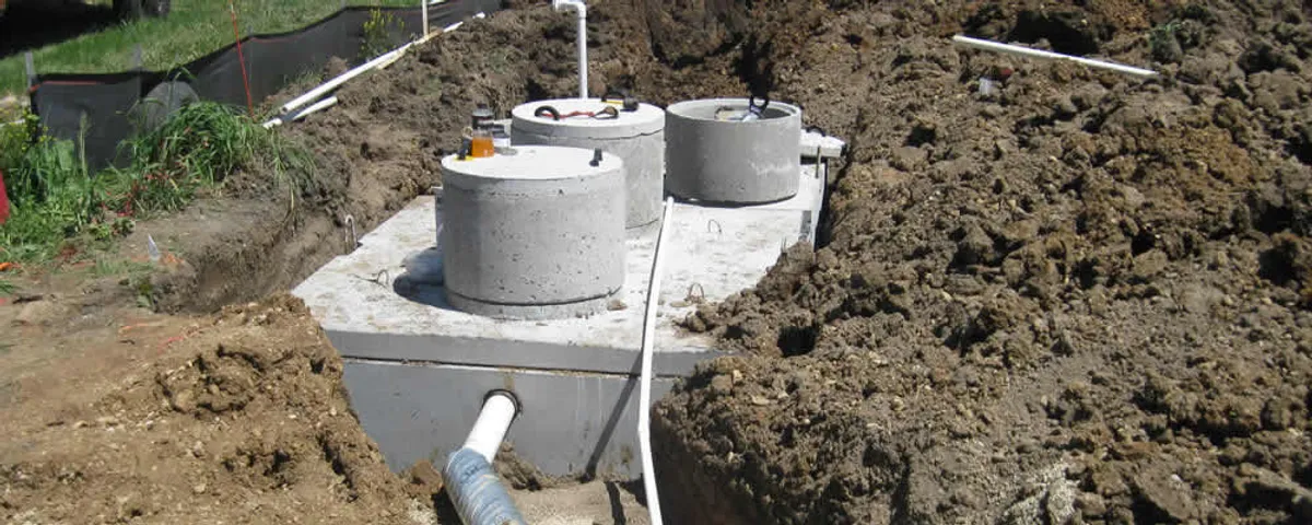 Septic system repair and installation site with tank access ports in Cape Coral, FL